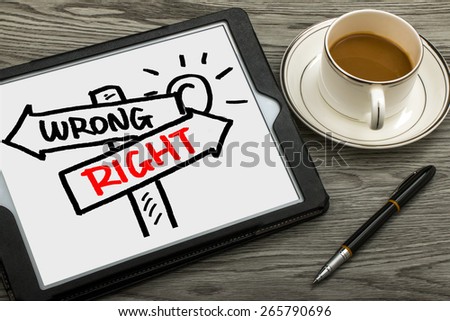 right or wrong signpost concept hand drawing on tablet pc