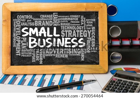 small business concept with related word cloud handwritten on blackboard