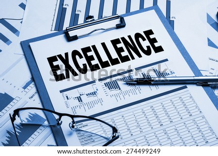 excellence concept on business clipboard