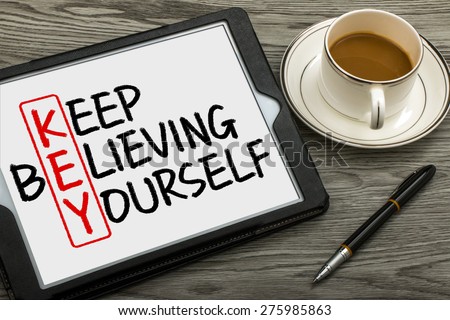 key concept:keep believing yourself handwritten on tablet pc