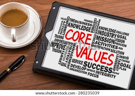 core values concept with business word cloud handwritten on tablet pc