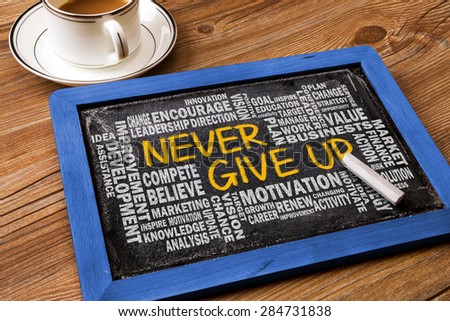 never give up concept with related word cloud on blackboard