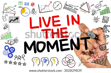 live in the moment handwritten on whiteboard