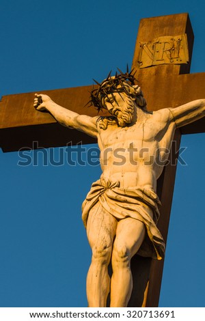 Statue of Jesus Christ at cross at the Palace of the Popes in Avignon a French commune in southeastern France