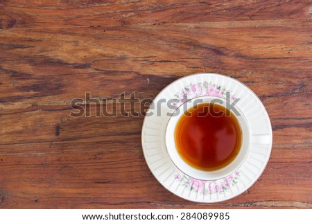 A cup of tea in English afternoon tea break on wooden table