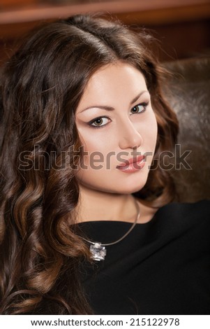 beautiful brunette woman face with brown eyes
