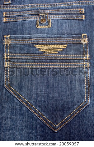 big back pocket on jeans with a yellow embroidery
