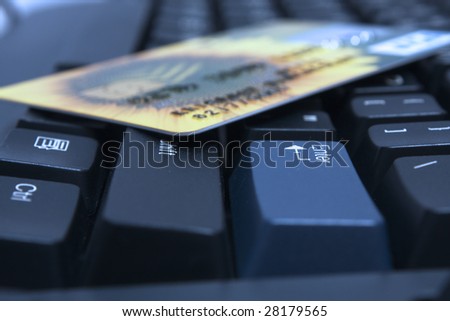 Credit card on a computer keyboard near to enter  key