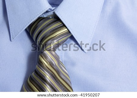 Close up of blue shirt with neck tie