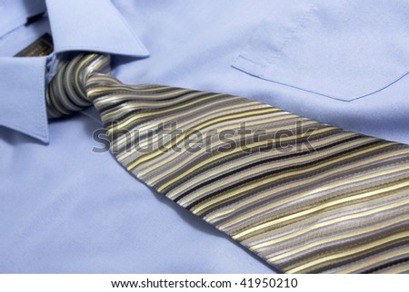 Close up of blue shirt with neck tie