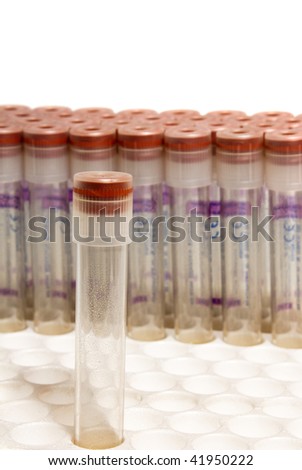 test tubes with red covers in rack isolated on white