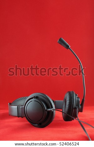the  photo of a stereo headphones on red background