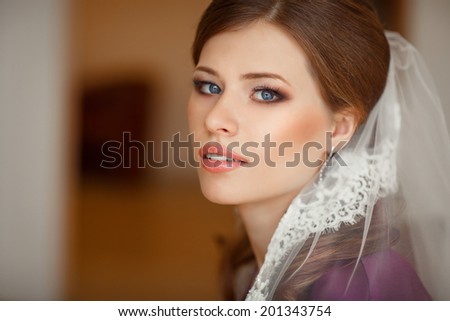 Beautiful bride wedding makeup and hairstyle. portrait of young bride at wedding day. series. soft tonality