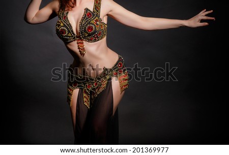Beautiful belly dance movement, arabian belly dancer. bellydance concept. exotic belly dancer woman. perfect body woman. studio. isolated.