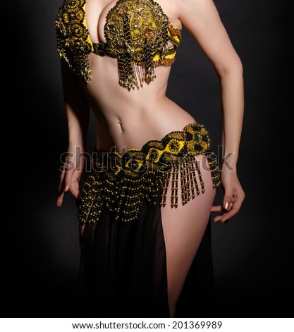 Beautiful belly dance movement, arabian belly dancer. bellydance concept. exotic belly dancer woman. perfect body woman. studio. isolated.