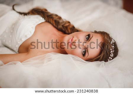 Beautiful bride wedding makeup and hairstyle. Young happy bride at marriage day. portrait of young bride at bridal day. soft tonality, selective focus, series.