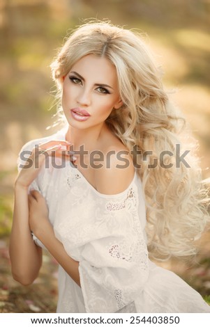 Beautiful woman Spring portrait outdoors smiling girl natural beauty, lovely female walking spring nature, portrait of young lovely woman in spring flowers. series