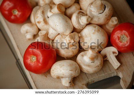 Champignon mushrooms fresh white mushroom slice fungus and tomato, diet and vegetarian, closeup mushrooms, selective focus, series