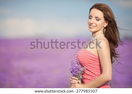 Beautiful woman lavender flowers, happy girl in lavender field, beauty female outdoor portrait, aromatherapy and health care, series, soft focus at sunset