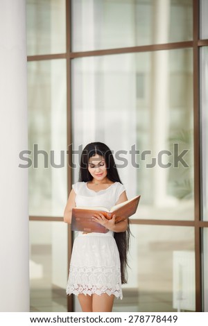 Female student outdoors campus college student young woman reading book girl with book, happy woman smiling, series