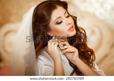 Beautiful Bride Portrait wedding makeup wedding hairstyle Wedding dress. Wedding decoration. Marriage day bride, soft selective focus. gorgeous young bride at home