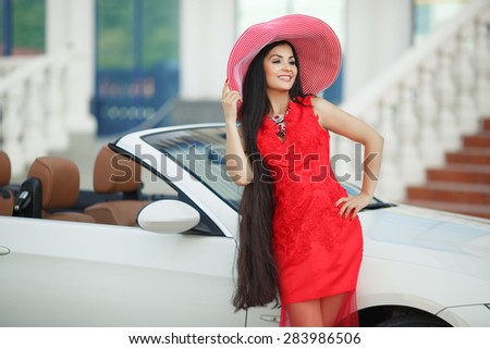 Beautiful woman car summer portrait girl in hat and red dress, glamour female in luxury car vacation lady, young woman in cabrio, series in my portfolio.