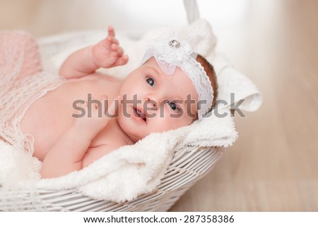 Cute newborn baby 1 month child sleeping in basket, adorable little girl new born kid portrait, happy baby portrait, beautiful little girl , soft tonality, series