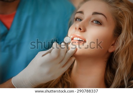 Dentist and female patient in dental clinic, Woman has teeth examined at dentists, Teeth care and tooth health. selective focus, series
