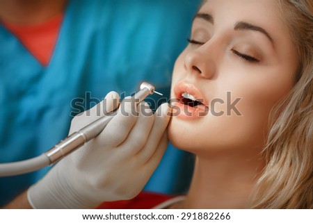 Female patient at Dentist, teeth care at dental clinic young girl with perfect smile at dentistry,  woman treat caries in tooth, Woman has teeth examined at dentists, tooth health. selective focus