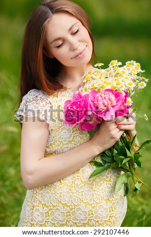 Beautiful Pregnant Woman outdoors portrait, pregnant lady with flowers, pregnancy girl portrait healthy pregnancy, pregnant young female in park summer, soft focus. series