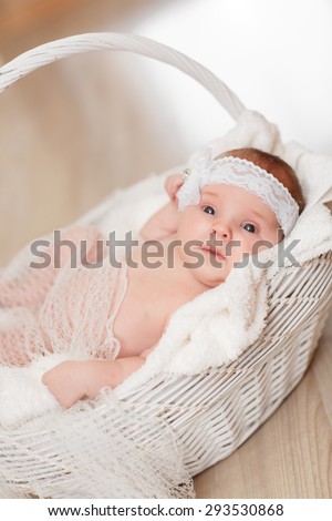 Cute newborn baby girl 1 month child sleeping in basket, adorable little girl new born kid portrait, happy baby portrait, beautiful little girl , soft tonality, series