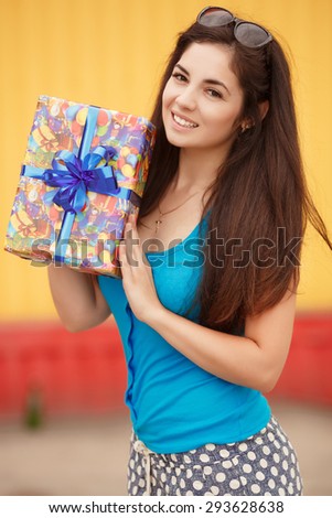 Shopping young woman with gift boxes at supermarket, happy girl with birthday present at shopping mall at sales, smiling female at birthday party with gifts, instagram style color filter,series