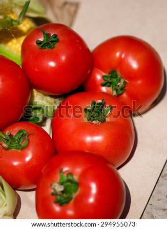 Fresh tomatoes and corn organic vegetables, raw tomato bio food, Group of tomatoes and golden corn diet food, healthy eating and healthy life concept, selective focus, series