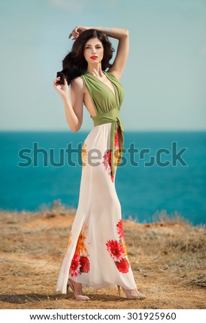 Fashion outdoor photo woman beautiful sensual model with long dark hair in luxurious summer dress, fashionable young girl vogue style model, glamour young woman outdoor, instagram style filter, series