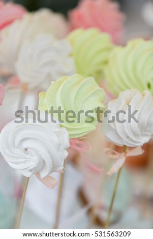 Delicious wedding candy bar or birthday party dessert table. Table with colorful sweets, candies, dessert, macaroons. Candy Bar buffet with cupcakes at restaurant.