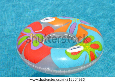 Colorful swim ring in the swimming pool