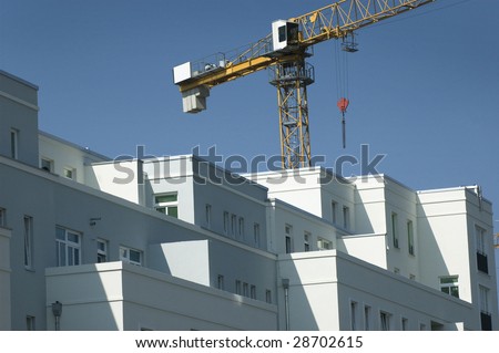 Apartment building with a crane in the background