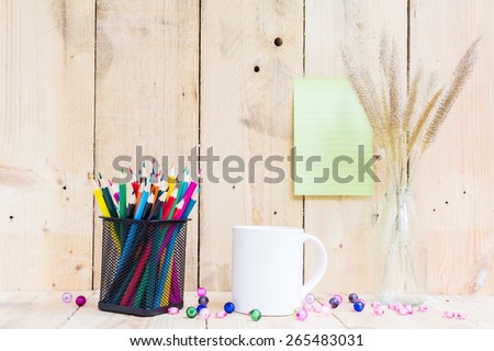 Color pencils and book on wooden background - Vintage effect style pictures