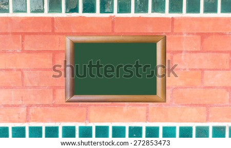 Red brick wall texture with wood image frame