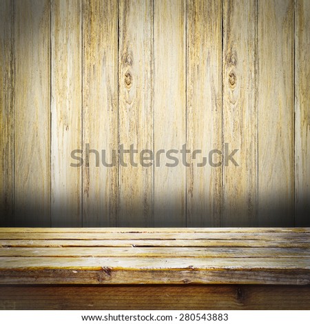 Wooden deck table on wood wall