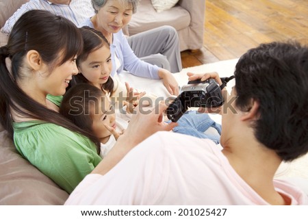 Father taking a video his family