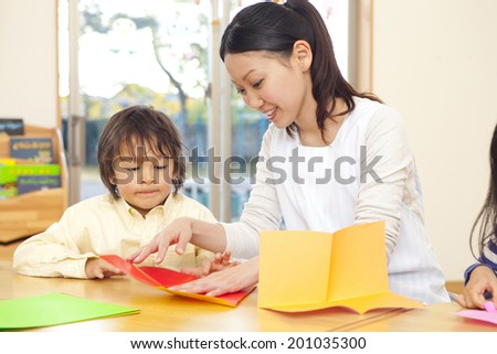 Nursery and boys folding origami