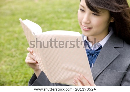The high school girl reading a book