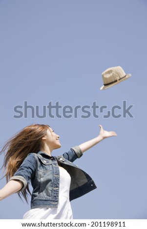The woman flying the hat