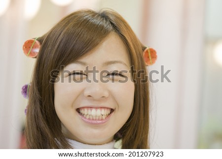 The woman with permed hair in salon