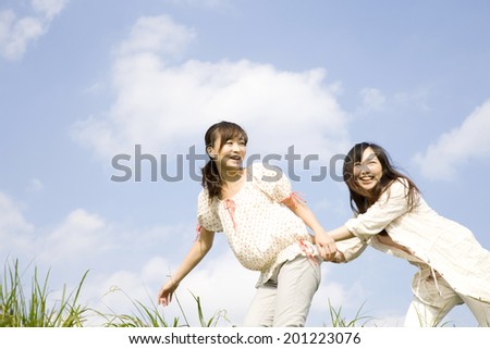 The woman being pushed back by friend