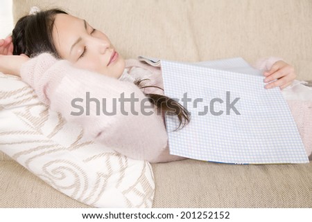 A woman sleeping on a couch