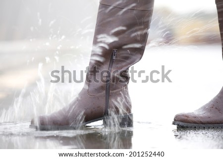 The feet of woman walking the water reservoir