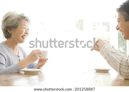 The old couple drinking coffee