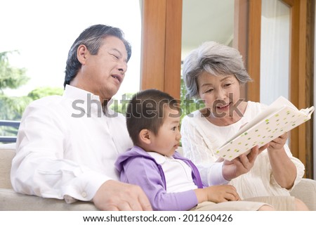 A grandma reading a book to her grandson